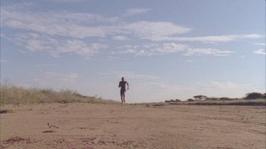 African man running viewed from side on in slow motion