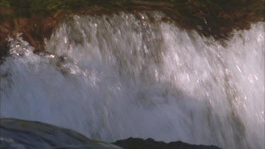 detail of waterfall rapid, water cascading