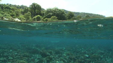 Village and reef as seen even with the ocean surface