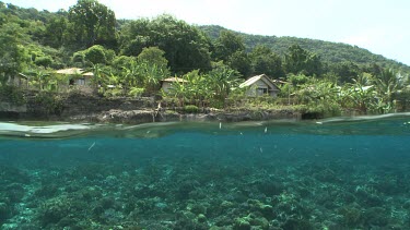 Village and reef as seen even with the ocean surface