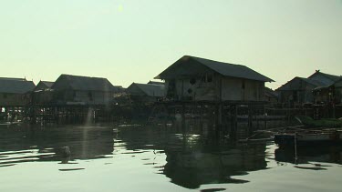 Boating by a village on stilts