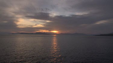 Sunset over the coast seen from the Seven Seas ship