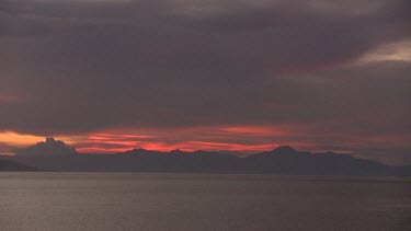 Sunset over the coast seen from the Seven Seas ship