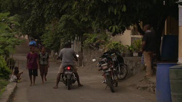 People on a whaling village street