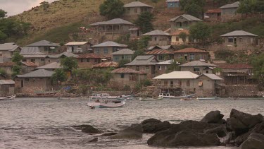 Village and a harbour on the coast