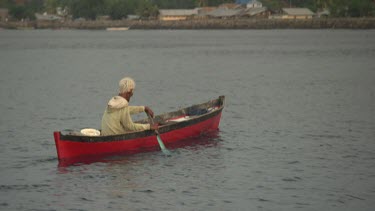 Maumere local in a canoe