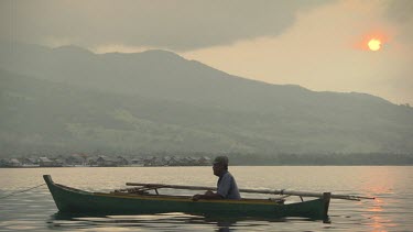 Maumere local in a canoe at sunset