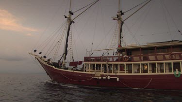 Seven Seas ship heading away at dusk