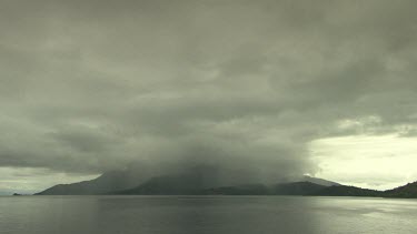 Rainstorm over a tropical island