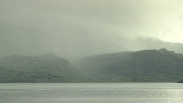 Rainstorm over a tropical island