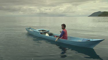 Fisherman hooking a Highfin Coral Grouper