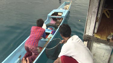 Fisherman preparing a caught fish