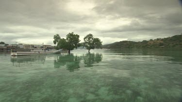 Tender boat heading into Bajau village