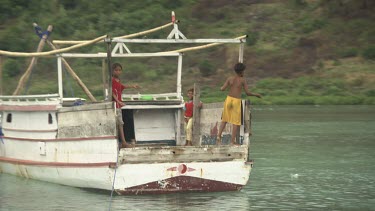 Tender boat leaving a harbour