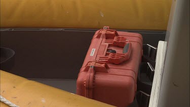 Red oxygen kit stored on a boat