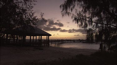 People at the Pier on Heron Island at sunset