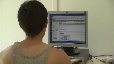 Student researchers working on computers