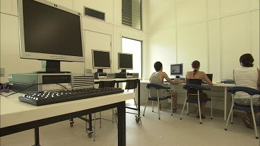 Student researchers working on computers