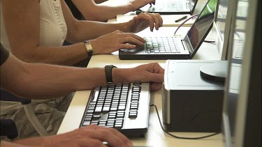 Student researchers working on computers