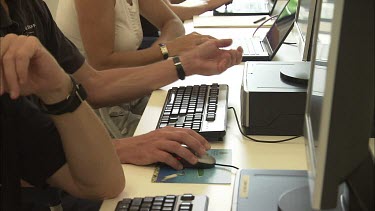 Student researchers working on computers