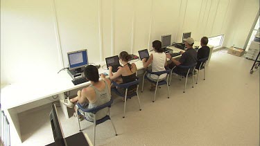 Student researchers working on computers