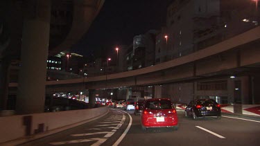 Traffic on a highway underpass at night