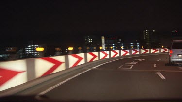 Driving down a city highway at night