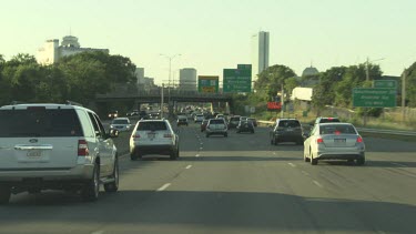 Traffic driving on a highway into the city