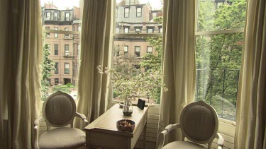 Elegant sitting room with a window facing a quiet street