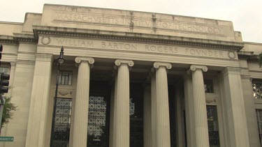 People on the steps of an MIT building with grand columns