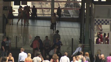 Visitors waiting in a busy tourist attraction