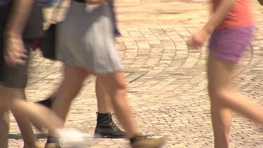 Pedestrians walking on a busy street