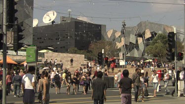 Pedestrians walking on a busy street