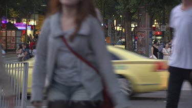 Time lapse of traffic and pedestrians on a busy city street