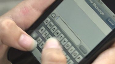 Close up of a person texting on a smartphone