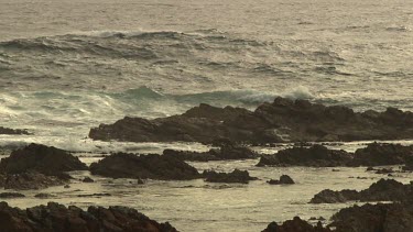 Waves beating against a rocky shore