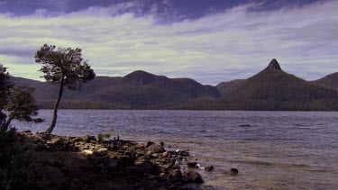 Rocks and mountains along the edge of a river