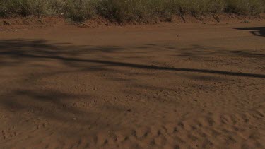 Van travelling over a dirt road