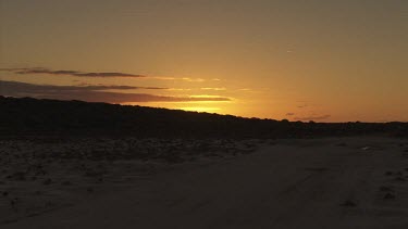 Golden sunset over a sandy desert
