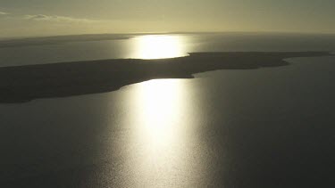 Sunlight reflected on the still ocean