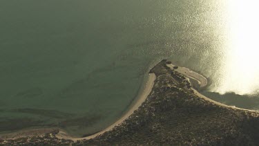 Sunlight reflected on the still ocean coast