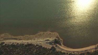 Sunlight along a sandy coast