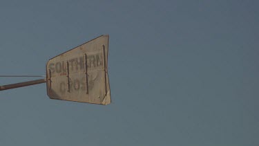 Sign for Southern Cross against a blue sky