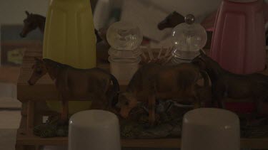 Close up of three brown ceramic horses