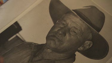 Black-and-white photograph of a man in a cowboy hat