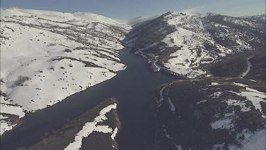 River through a snow-covered mountain landscape