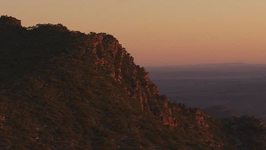 Misty, forested mountain peaks in the Flinder Ranges at dusk