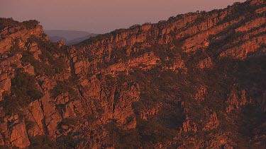 Misty, forested mountain peaks in the Flinder Ranges at dusk