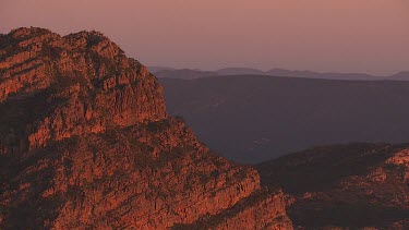 Misty, forested mountain peaks in the Flinder Ranges at dusk