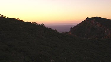 Misty, forested mountain peaks in the Flinder Ranges at dusk